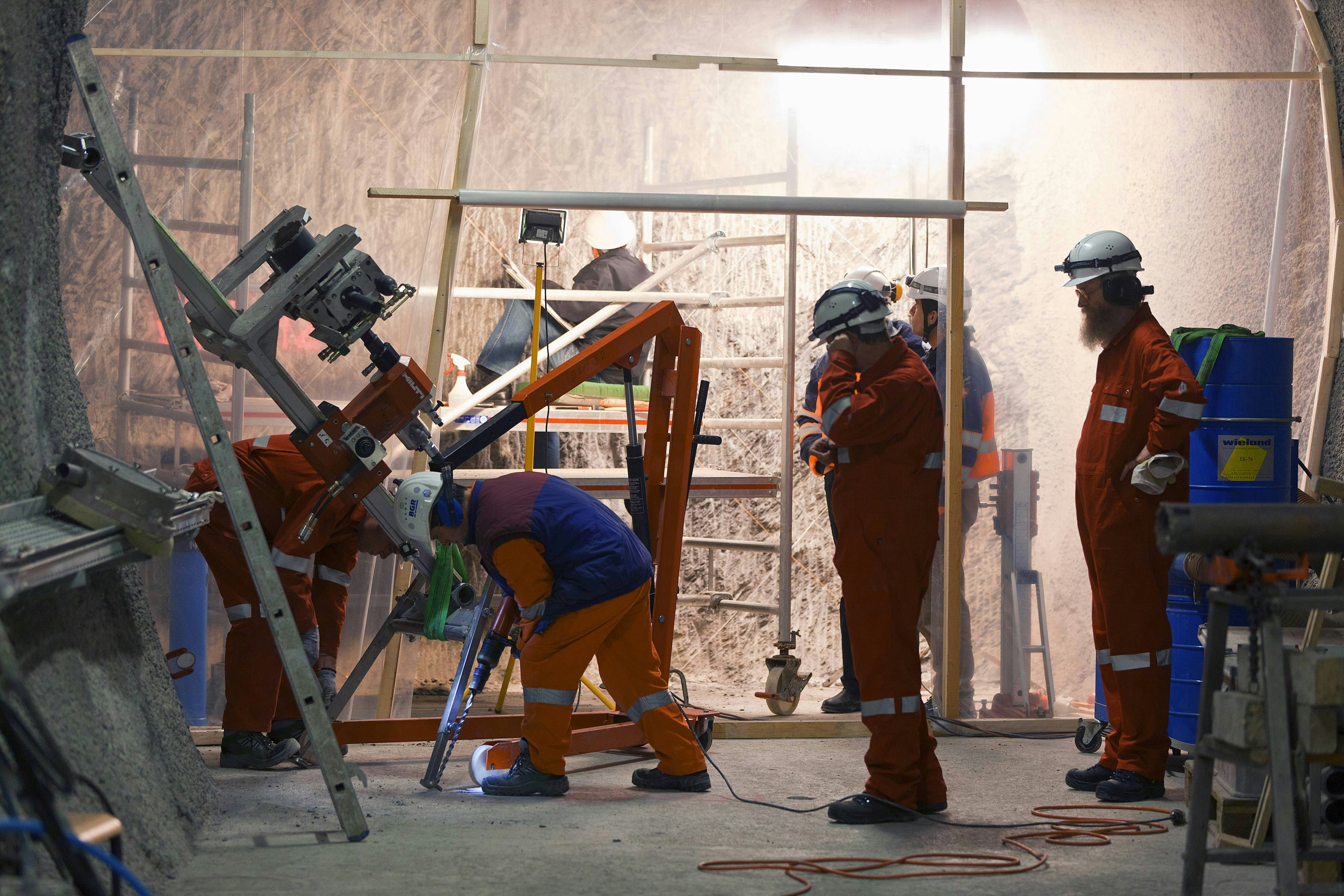 Researchers from the Federal Institute for Geosciences and Natural Resources (BGR) during the drilling of a borehole in the Mont Terri rock laboratory. 
